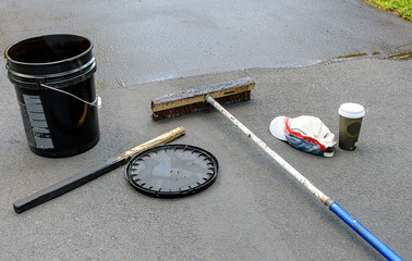 Some  items needed to reseal an asphalt driveway 