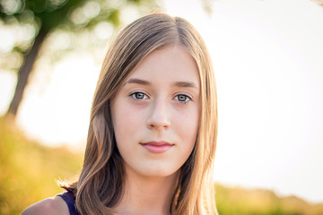 Close-up portrait of blond teen girl. Casual style