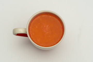 Glasses of carrot juice with vegetables on table close up