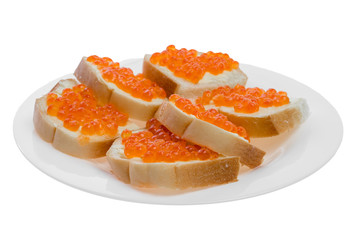 Naklejka na ściany i meble White bread sandwiches with salmon red caviar on glass white plate. Delicious appetizer. Seafood. Expensive delicacy. Isolated on white background