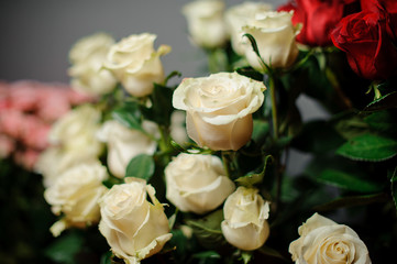 Beautiful bouquet of white color roses in the transparent wrapping paper