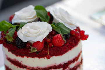 Red velvet cake with close up with white roses