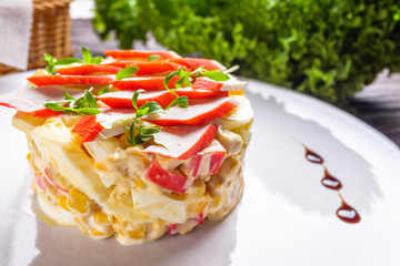 salad of fish sticks on dark wooden rustic background