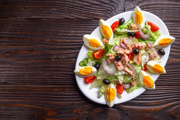 tuna salad on dark wooden rustic background