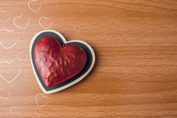Obraz na płótnie Canvas two red vintage heart on wood ground in valentine concept