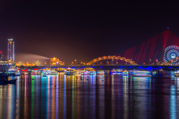 Fototapeta na wymiar Dragon Bridge (Cau Rong) illuminated at night, Da Nang Vietnam