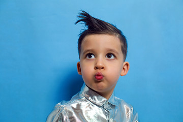 child a boy of three years old with a fashionable hairstyle