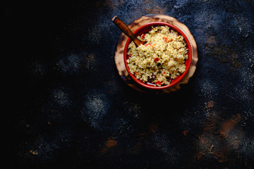 Tabule. Arabian vegetarian salad with couscous. Dark background. Isolated