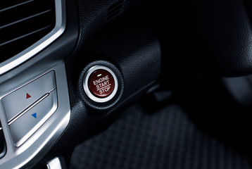 Engine start / stop button of luxury car, automotive part concept.