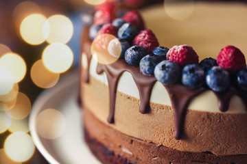 Beautiful fresh sweet cake with berry and chocolate
