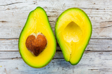 Avocado halves with heart-shaped seed.