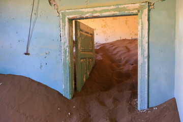 Abandoned and forgotten building and room left by people and being taken over by encroaching...