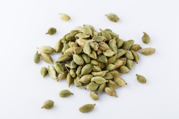 fragrant green cardamom on a white acrylic background