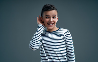 Fashionable boy on a gray background