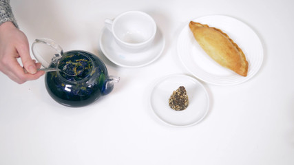 Obraz na płótnie Canvas blue tea from the flowers klitoria in teapot. fashionable design food