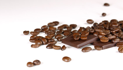 Naklejka premium coffee beans and chocolate on a white background