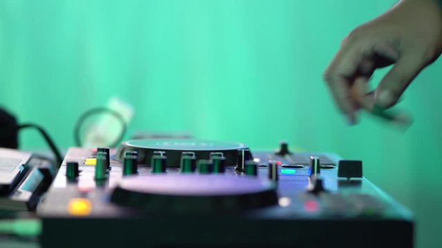 DJ playing music in club house