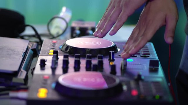 DJ playing music in club house