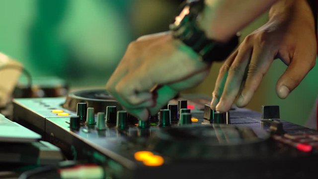 DJ playing music in club house