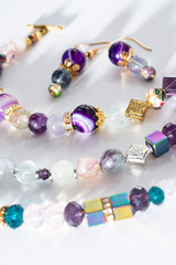 gold jewelry bracelets  with semiprecious and crystal at white background