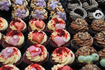 homemade cupcakes decorated with pink hearts