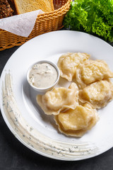 traditional Ukrainian dish of dumplings with sour cream