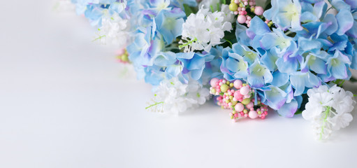 Flower frame, banner. Postcard with blue hydrangea flowers on a white background. Space for text.
