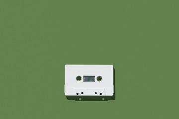 Fototapeta premium Audio cassette on colored background. Audio cassette tape. Vintage disco poster.