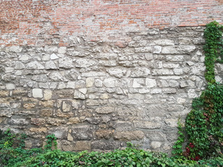 Brick and masonry medieval walls in Lviv on Mytnaya Square. Monument of architecture of Ukraine...