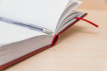 open diary with pen, notebook. business and planning concept