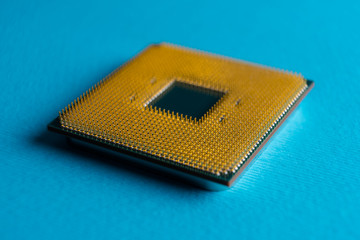 computer processor, gold-plated contacts, macro photo on a blue background
