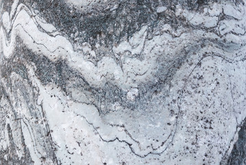 The plate is made of marble in black and white shades. Smooth texture for design and decoration. Natural building material. Natural patterns on the stone. Plates for floor and walls