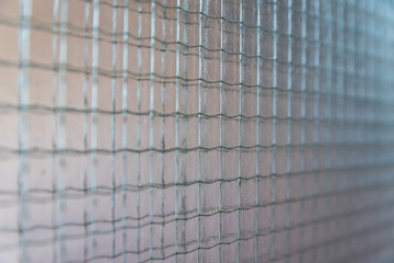 Type of glass. Metal mesh in the glass.
