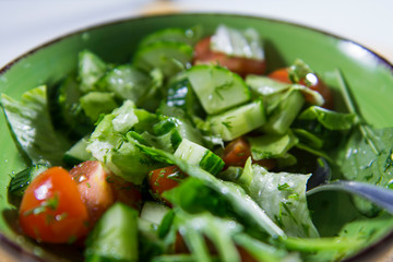 spinach leaves in a plate. Salad of fresh vegetables and herbs.