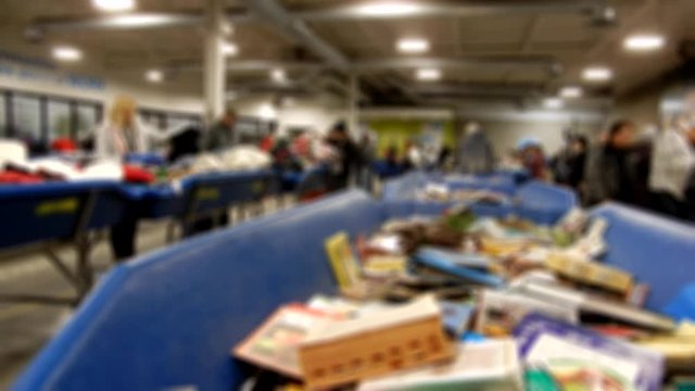 People Looking For Items In Goodwill Store Slightly Blurred