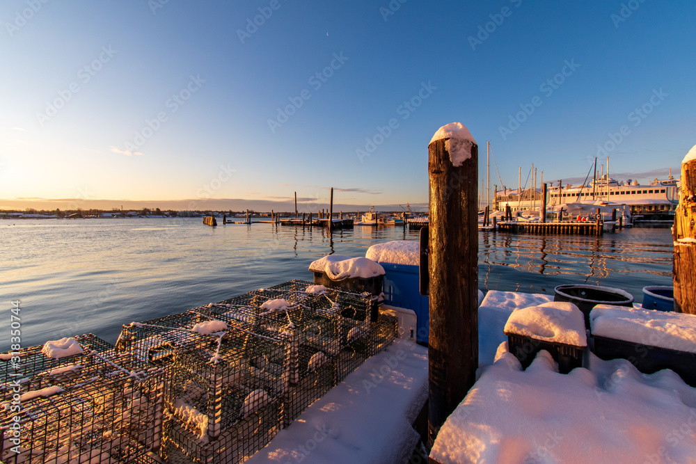 Wall mural Winter sunrise from a wharf in Portland, Maine.