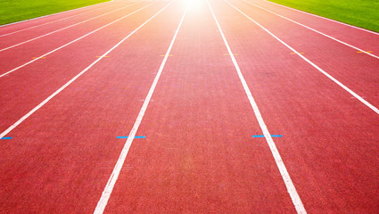 Achievement concept. Track running, Red treadmill in sport field at the stadium