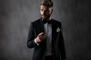 businessman standing with hand folded and posing cool