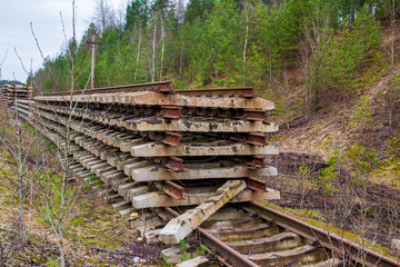 big pile of old abandoned rails and sleepers