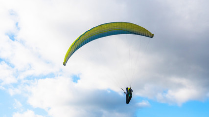 Extreme air sport Paragliding against the blue sky