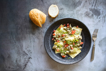 Spinach Ricotta Ravioli with Sausage and Tomatoes