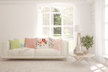 Stylish room in white color with sofa and summer landscape in window. Scandinavian interior design. 3D illustration