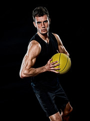 caucasian young basketball player manisolated black background