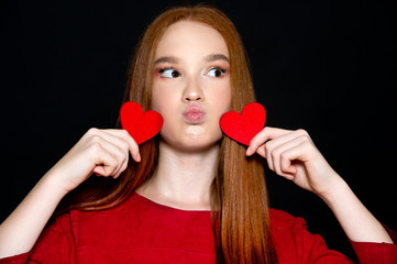 Valentine's Day. Beautiful girl with heart.  Love and valentines day woman holding red heart