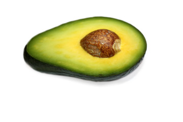 Half avocado with seed isolated on the white background.