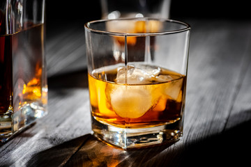 a glass of whiskey with ice