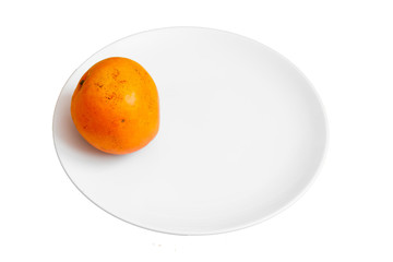 Top view of a plate of orange mango isolated on white background.