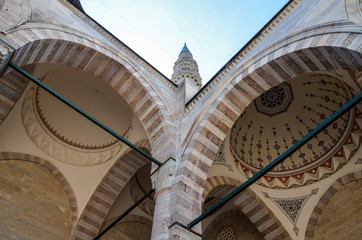 The view of inner courtyard surrounded by the arched gallery in Suleymaniye Mosque, Istanbul, Turkey 