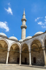 Fototapeta na wymiar The view of inner courtyard surrounded by the arched gallery in Suleymaniye Mosque, Istanbul, Turkey 