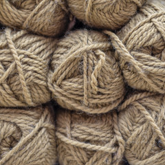 Multicolored wool balls of yarn. Background of colored yarn balls. Embroidery. Knitting.